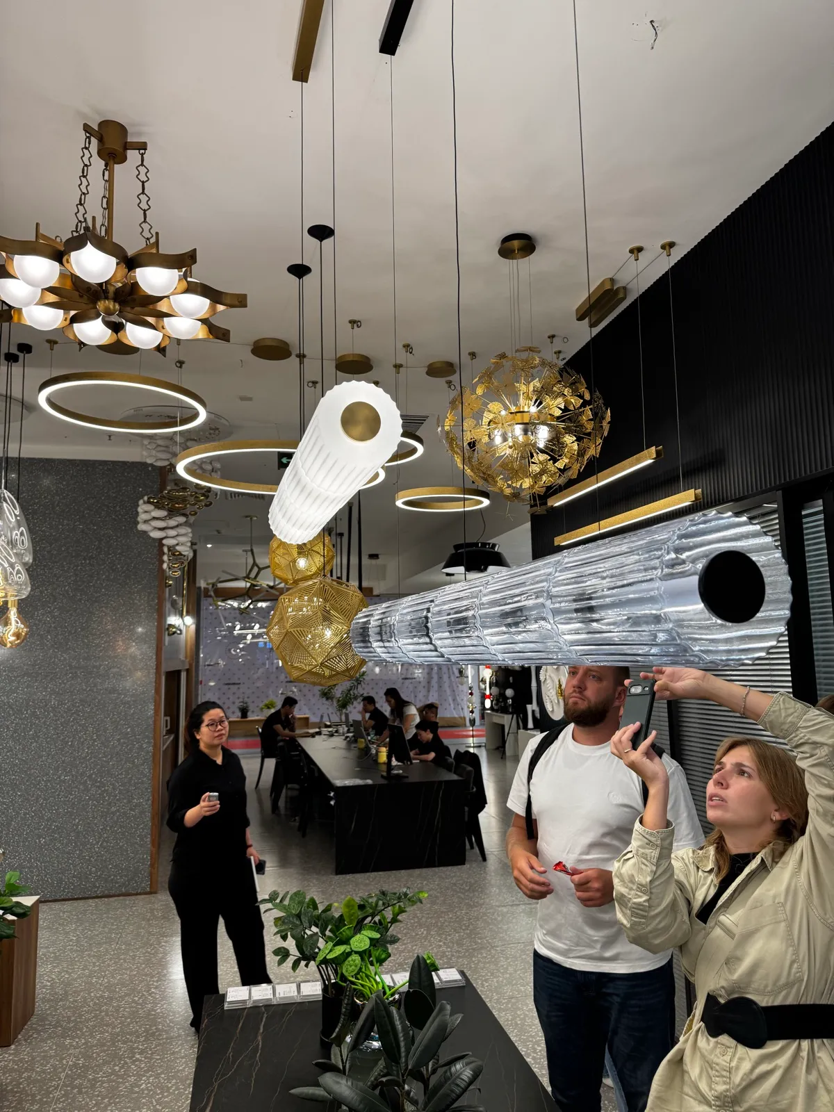 Dream View clients choosing lighting in a Chinese showroom